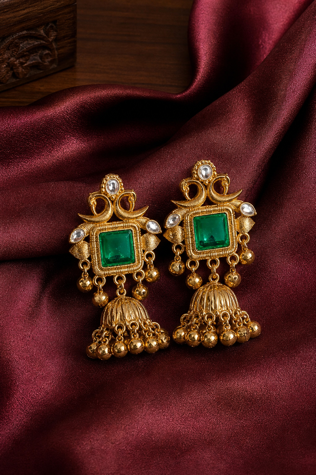 elegant stone jhumka earrings with antique gold finish elegant stone jhumka earrings with antique gold finish